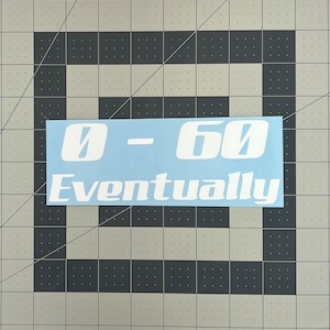 May include: A light blue sticker with white text that reads "0-60 Eventually".