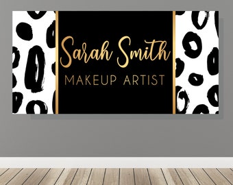 May include: Black and white canvas print with a gold border. The print features a leopard print pattern and the text "Sarah Smith Makeup Artist".