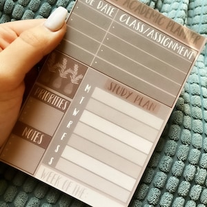 May include: A weekly academic planner with a brown and white color scheme. The planner has sections for due dates, class assignments, priorities, notes, and a study plan. The planner also has a section for the week of the month.
