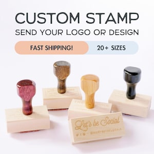 May include: Four wooden stamp blocks with different colored handles. The stamps are engraved with text and designs. The text on the stamps reads "The Owns", "Let's be Social", and "@MARYBETHFLORALS".