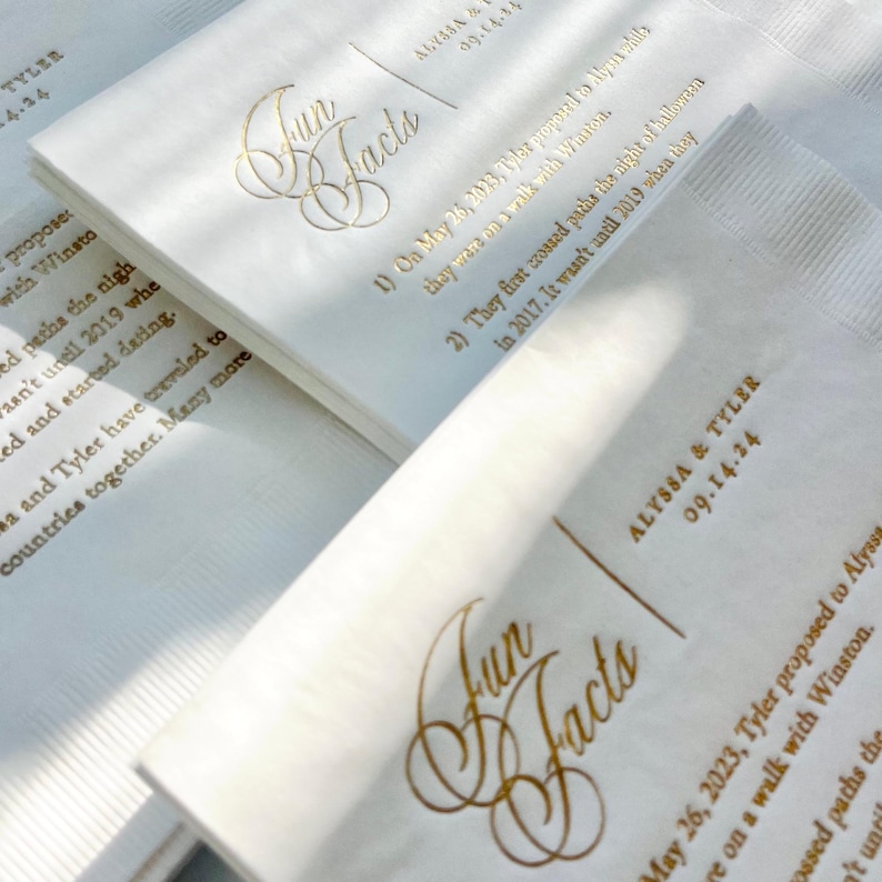 a close up of a paper with gold lettering on it