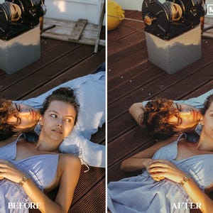 May include: A couple lying on a wooden deck, the woman in a light blue dress and the man in a light blue shirt. The woman is looking at the camera and the man is resting his head on her shoulder. The image is warm and inviting.