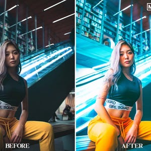 May include: A woman wearing a black crop top with the text "Girl Squad" in white, yellow pants, and long, straight, light gray hair. She is sitting on a bench in a modern building with a glass escalator in the background.