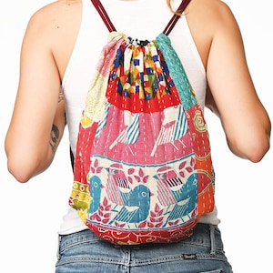 large kantha bag, colorful fun purse, tote shoulder bag, hippie boho style, features bright geometric patterns, casual every day bag, made in india, made by artisans, soft cotton material, handheld bag, long straps, drawstring bookbag, festival purse
