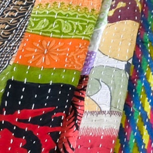 long patchwork scarf, colorful fun accessory, hippie boho style, features bright geometric patterns, casual every day scarf, made in india, made by artisans, soft cotton material, end strings, warm winter wrap, kantha fabric