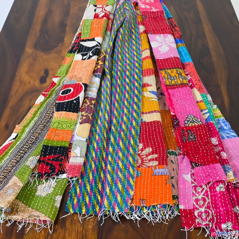long patchwork scarf, colorful fun accessory, hippie boho style, features bright geometric patterns, casual every day scarf, made in india, made by artisans, soft cotton material, end strings, warm winter wrap, kantha fabric