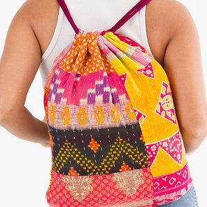 large kantha bag, colorful fun purse, tote shoulder bag, hippie boho style, features bright geometric patterns, casual every day bag, made in india, made by artisans, soft cotton material, handheld bag, long straps, drawstring bookbag, festival purse