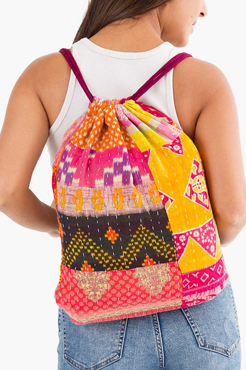 large kantha bag, colorful fun purse, tote shoulder bag, hippie boho style, features bright geometric patterns, casual every day bag, made in india, made by artisans, soft cotton material, handheld bag, long straps, drawstring bookbag, festival purse