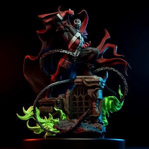 May include: A detailed figurine of a comic book character, posed dynamically. The figure is clad in a black and red suit with a white cross design. A long red cape flows behind the figure. The base features a stone structure with green energy effects.