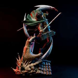 May include: A detailed figurine of a character from the anime series Attack on Titan. The figure is posed dynamically, with a green cape, dual swords, and a utility pack. The base features a hand-like structure and a tiled roof.
