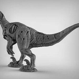 May include: A gray, detailed, plastic dinosaur figurine with a textured surface. The dinosaur is posed in a running position with its head turned to the side.