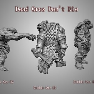 May include: Three gray painted miniature zombie orcs, one holding an axe, one with a chainmail shirt, and one with a tattered shirt. The miniatures are posed in different action poses. The text "Dead Orcs Don't Die" is written above the miniatures.