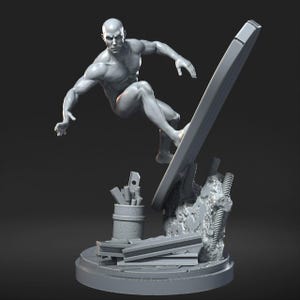May include: A gray sculpture of a bald figure surfing on a board, with a detailed muscular physique. The figure is posed dynamically, with a cityscape base and a cylindrical container with objects. The sculpture is on a round base.