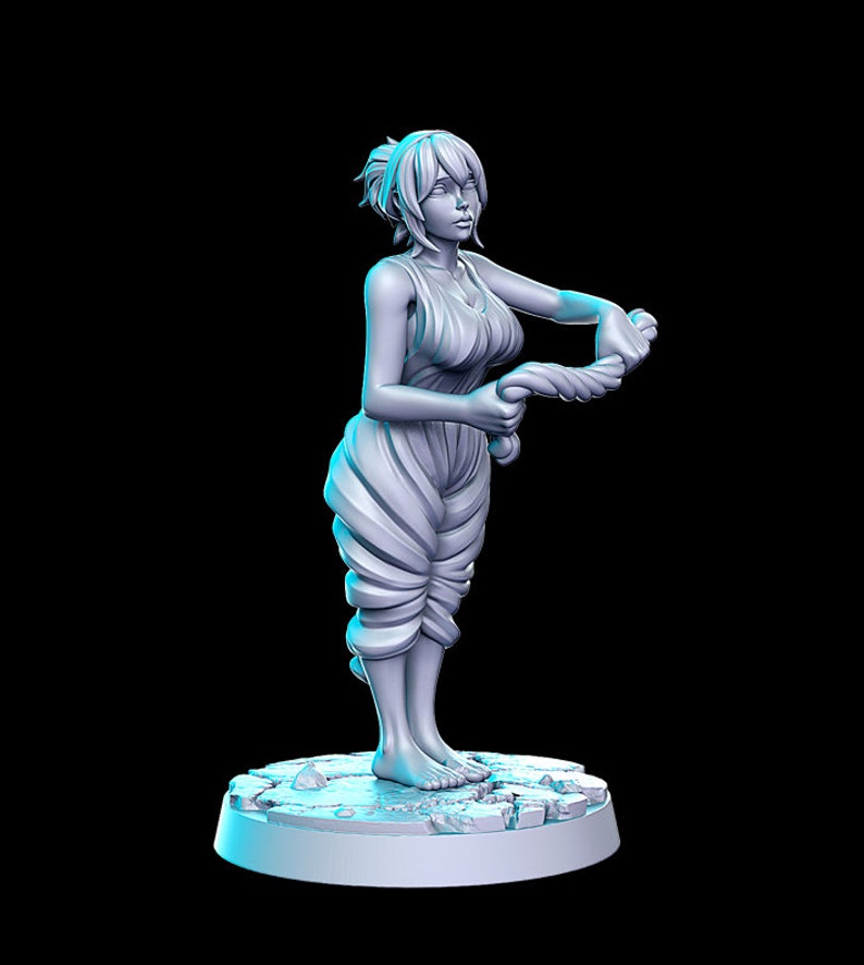 May include: A gray figurine of a woman with short hair, wearing a flowing garment, standing on a broken stone base.