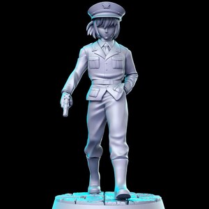 May include: A white painted figurine of a person wearing a military uniform and a cap. The figurine is holding a gun in their right hand and is standing on a circular base.