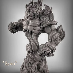 May include: A gray, detailed miniature sculpture of a humanoid figure with a fiery mane and a muscular build. The figure is standing on a base of flames. The sculpture is labeled "Ryan".