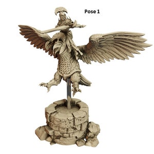 May include: A beige miniature figurine of a warrior riding a griffin, with wings outstretched, holding a sword. The figurine is mounted on a stone base.