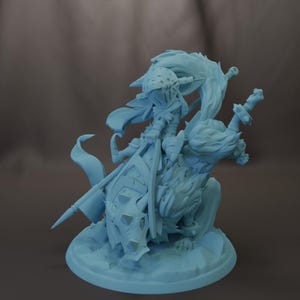 May include: A light blue figurine of a fantasy character riding a wolf-like creature. The character is armored and holds a sword and a banner. The figurine is on a round base.