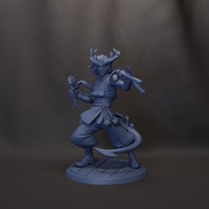 May include: A blue figurine of a character in a dynamic pose, holding two weapons. The figure wears a detailed outfit with a horned headpiece and a flowing sash. The base is a wooden plank design.