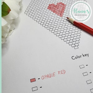 May include: A printable pattern for a heart-shaped bead design. The pattern is black and white with a color key showing opaque red beads.