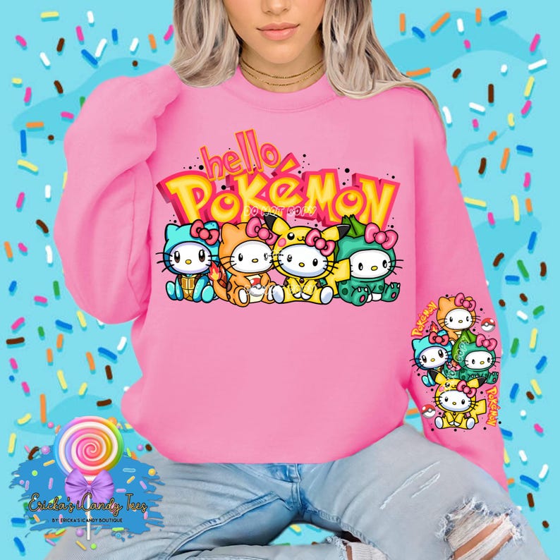 May include: Pink sweatshirt featuring the text "hello Pokemon" in a colourful graphic font. The graphic depicts a row of cartoon characters with Hello Kitty-like faces wearing Pokemon hats.
