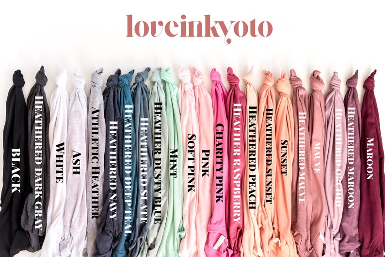 K&ouml;nnte beinhalten: Eine Auswahl an T-Shirt-Farben, darunter Schwarz, Wei&szlig;, Asche, Marineblau meliert, Dunkelblau meliert, Schiefer meliert, Staubblau meliert, Minze, Rosa, Rosa, Charity Pink, Himbeer meliert, Pfirsich meliert, Sonnenuntergang, Sonnenuntergang meliert, Mauve, Mauve meliert, Orchidee meliert, Maroon meliert und Maroon.