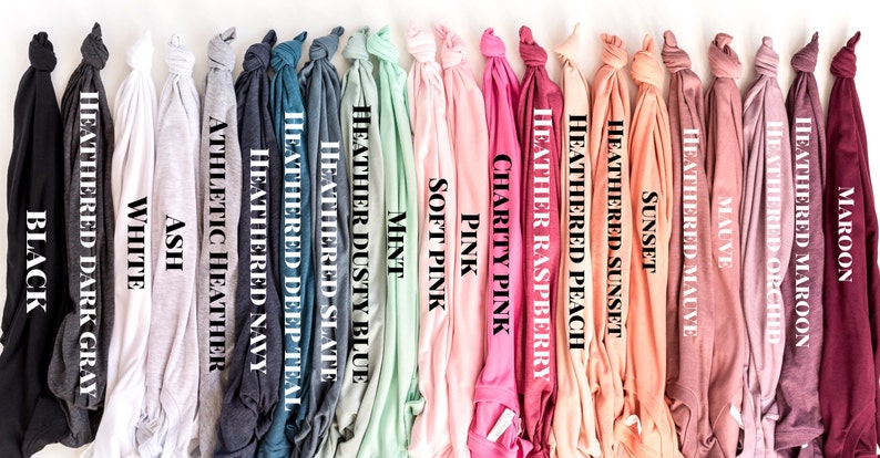 May include: A variety of t-shirt colors, including black, white, ash, heather navy, heather teal, heather slate, heather dusty blue, mint, soft pink, pink, charity pink, heather raspberry, heather peach, heather sunset, sunset, mauve, heather mauve, heather orchid, heather maroon, and maroon.