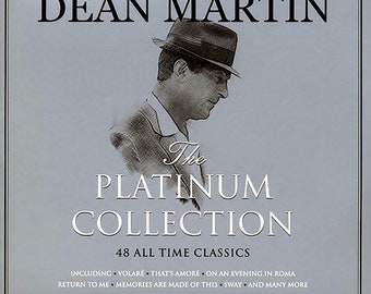 May include: A Dean Martin album cover with a silver and white design. The album is titled "The Platinum Collection" and features a black and white image of Dean Martin wearing a hat. The cover includes the text "48 All Time Classics" and a list of song titles.
