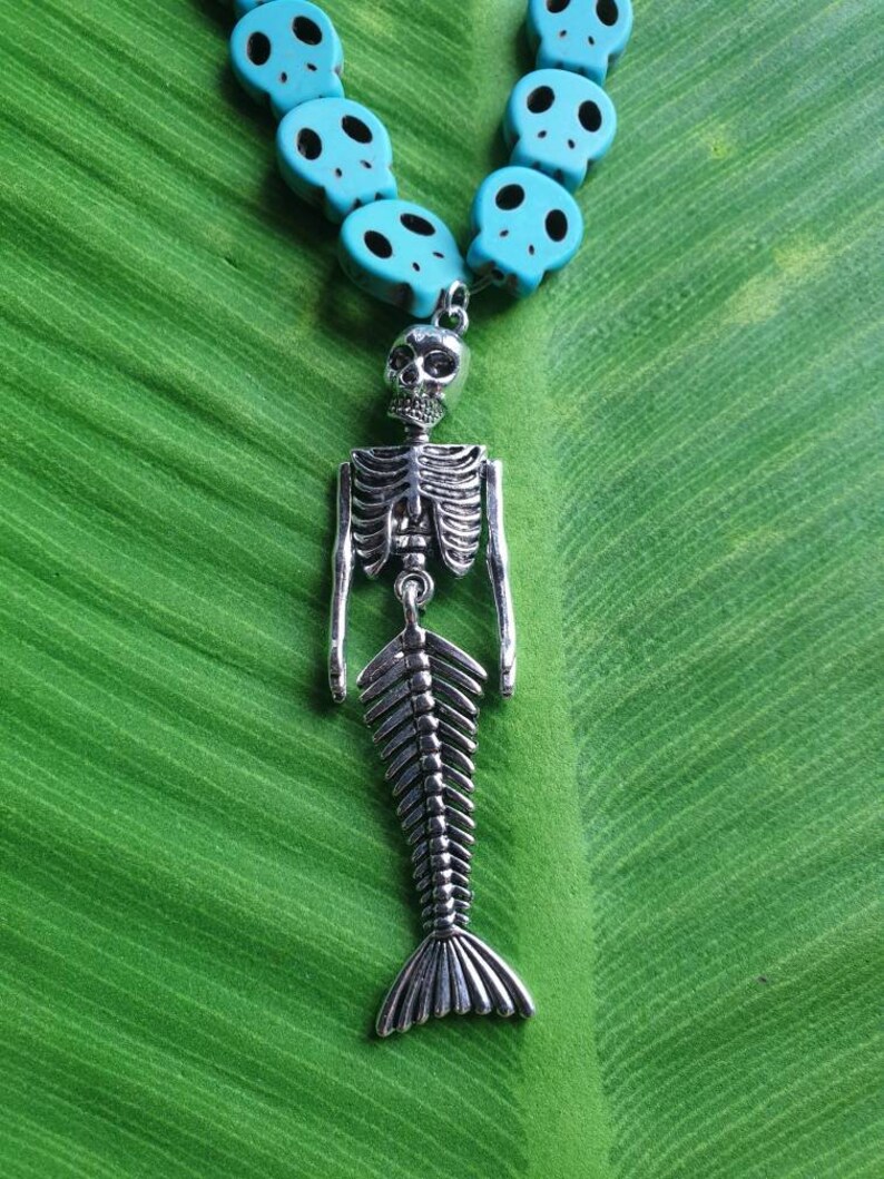 Punk necklace with mermaid skeleton tropical tiki beaded skulls of various white and turquoise colors pinup exotic