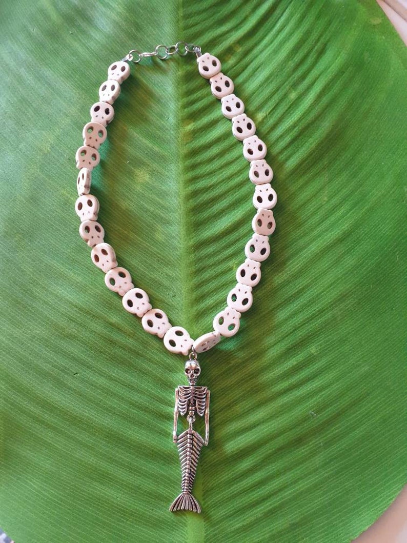 Punk necklace with mermaid skeleton tropical tiki beaded skulls of various white and turquoise colors pinup exotic