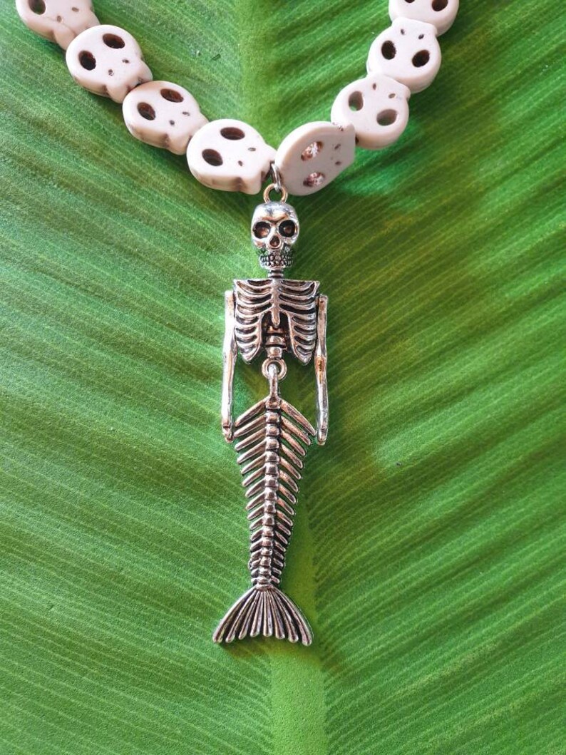 Punk necklace with mermaid skeleton tropical tiki beaded skulls of various white and turquoise colors pinup exotic