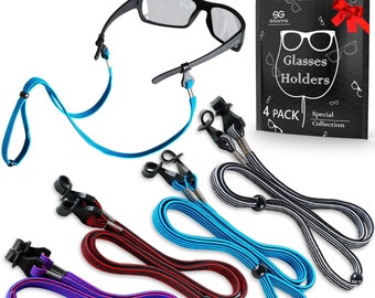 May include: Four pack of glasses holders in black, red, blue, and purple with black and white striped holders. The holders are made of elastic and have a black bead at the end. The package says "Glasses Holders 4 Pack Special Collection".