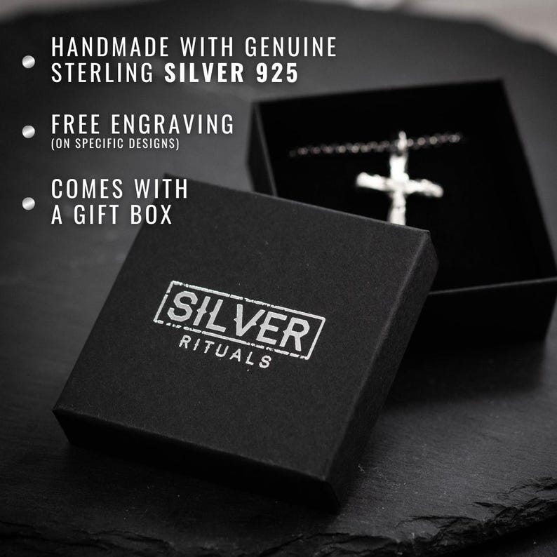 a black box with a silver cross on it