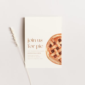 May include: An invitation card with the text "join us for pie" in a warm brown font. A watercolor illustration of a pie slice is on the right. The card also includes details for a Thanksgiving dinner hosted by Jill & Kevin.