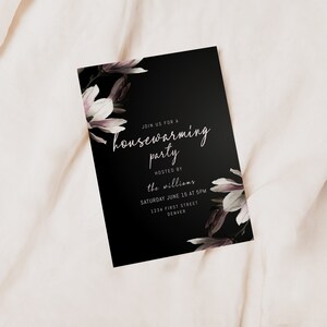 May include: Black and white housewarming party invitation with a floral design. The invitation reads "Join us for a housewarming party hosted by the Williams, Saturday June 15 at 5pm, 1234 First Street, Denver."