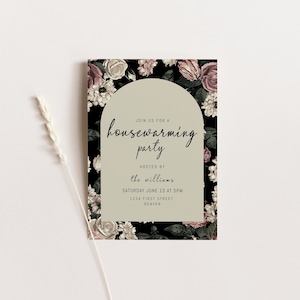May include: A floral-themed housewarming party invitation with a black background and pink and white flowers. The text reads "Join us for a housewarming party hosted by the Williams, Saturday June 15 at 5pm, 1234 First Street, Denver."
