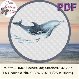 May include: A cross stitch pattern featuring a blue dolphin jumping out of the water. The pattern is 137 stitches wide by 57 stitches high and uses 30 colors. The pattern is designed for 14 count Aida fabric, which measures 9.8 inches wide by 4 inches high.