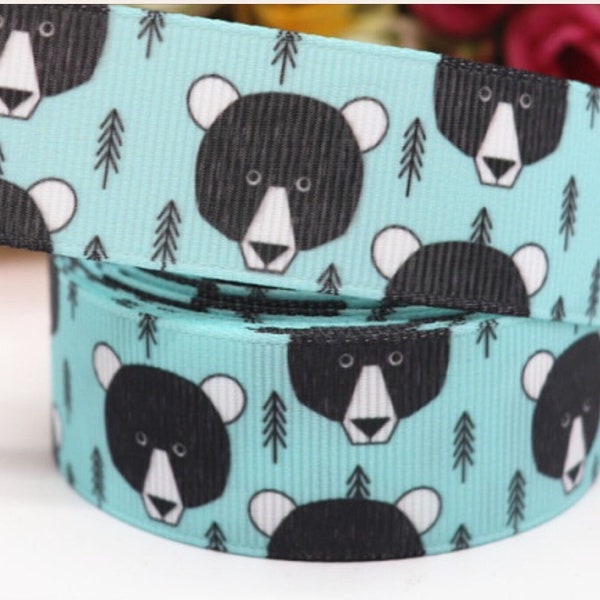 THE BEAR and the EVERGREEN!  Choose 3 or 5 yds. of grosgrain ribbon, a very delightful bear, Smokey’s  cousin & it makes a darn good gift!