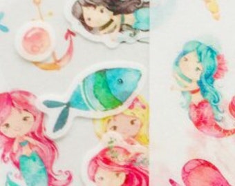 May include: A sheet of colorful stickers featuring mermaids, fish, anchors, seashells, and other ocean-themed designs. The stickers are perfect for adding a touch of whimsy to journals, planners, and other craft projects.