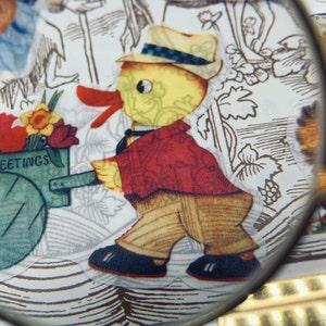 May include: A vintage Easter card featuring a yellow chick pushing a green wagon with flowers and the text "Easter Greetings". The chick is wearing a red jacket and a black and white hat.