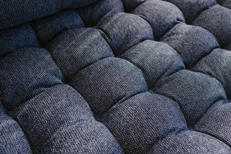 Dark blue outdoor cushion set on a bench, featuring a bottom seat cushion and matching backrest in French mattress style. Made from high-quality EU-produced bouclé-like fabric suitable for outdoor use. The material is water-repellent but not fully waterproof and can get wet occasionally. Also suitable for indoor spaces. Perfect for modern Scandinavian homes, A-frame houses, Portuguese terraces and bohemian Spanish villas.