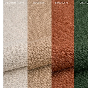 May include: Close-up of five fabric swatches in cream white, beige, brick red, green, and black. The fabric has a boucle texture. The text "BOUCLE" is at the top of the image. The text "Weight: 570 g/m&sup2; &plusmn; 5%" is below the fabric swatches. The text "Composition 93% PES, 6% ACR, 1% COT" is below the weight text. The text "Non-flammable" is below the composition text. The text "CREAM WHITE 2074", "BEIGE 2076", "BRIQUE 2078", "GREEN 2089", and "BLACK 2082" is above the fabric swatches.