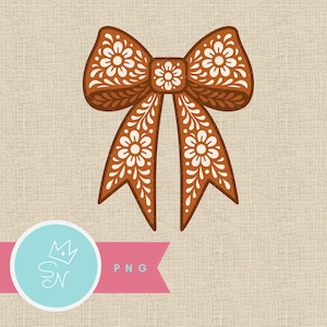 May include: A brown bow with white floral patterns. The bow has a detailed design with a central knot and flowing tails. The background is a textured beige fabric. A logo with text is at the bottom.
