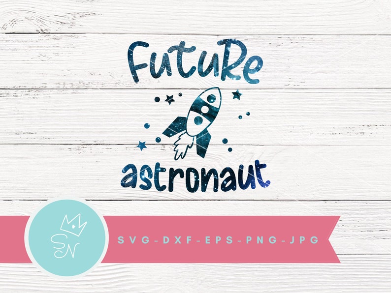 May include: A blue and white rocket with stars and the text "Future astronaut" on a white wood background.