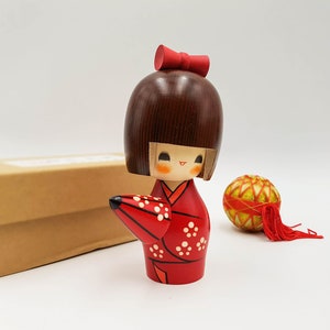 Wooden Kokeshi doll Amayadori painted in red white and brown figurine