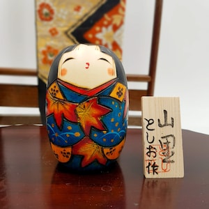 Yamazato wooden Kokeshi doll painted blue and orange leaves figurine Japan handmade artisanal