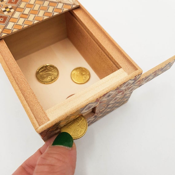 Boîte de rangement secrète pour l'argent et les pièces