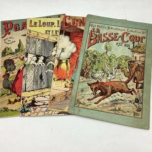 May include: Four vintage children's books with colorful illustrations. The covers feature a wolf, a hen, a fox, and a rooster. The titles are "Le Loup. I et Le", "La Basse-Cour est en", and "Pea".