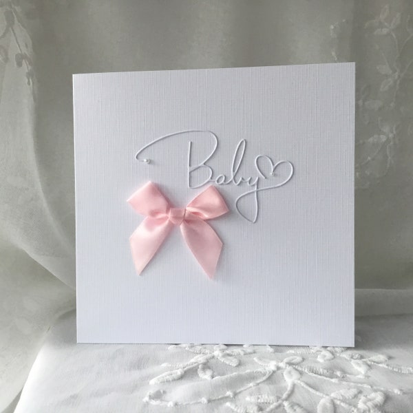 New baby girl card, handmade minimalist design, pink bow, congratulations baby daughter, white linen card, it’s a girl, pink and white card