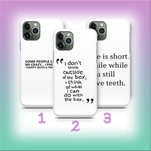 May include: Three white phone cases with black text. The first case reads "SOME PEOPLE CALL ME CRAZY... I PRE 'HAPPY WITH A TWI". The second case says "I don't think outside of the box; I think of what I can do with the box." The third case says "Life is short. Smile while you still have teeth."